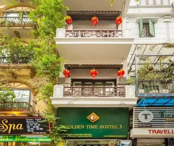 Golden Time Hostel 3 building facade in Hanoi Old Quarter with red lanterns on balconies